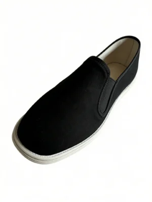 LUNO LN-M4001 men's hand-stitched cloth shoes - angled side view highlighting the sleek black canvas upper, elasticized slip-on opening for easy wear, and the clean white rubber sole with visible stitching; a minimalist design that merges traditional handcrafting with modern casual comfort.