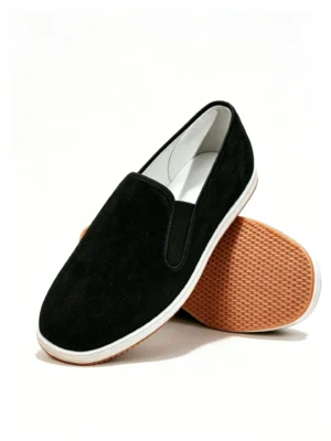 LUNO LN-M4003 men's traditional handmade corduroy cloth shoes with rubber sole - angled side view highlighting the soft black corduroy upper, elastic side panels for slip-on convenience, and the layered white-and-brown rubber sole; the design blends heritage craftsmanship with modern comfort, perfect for casual everyday wear.