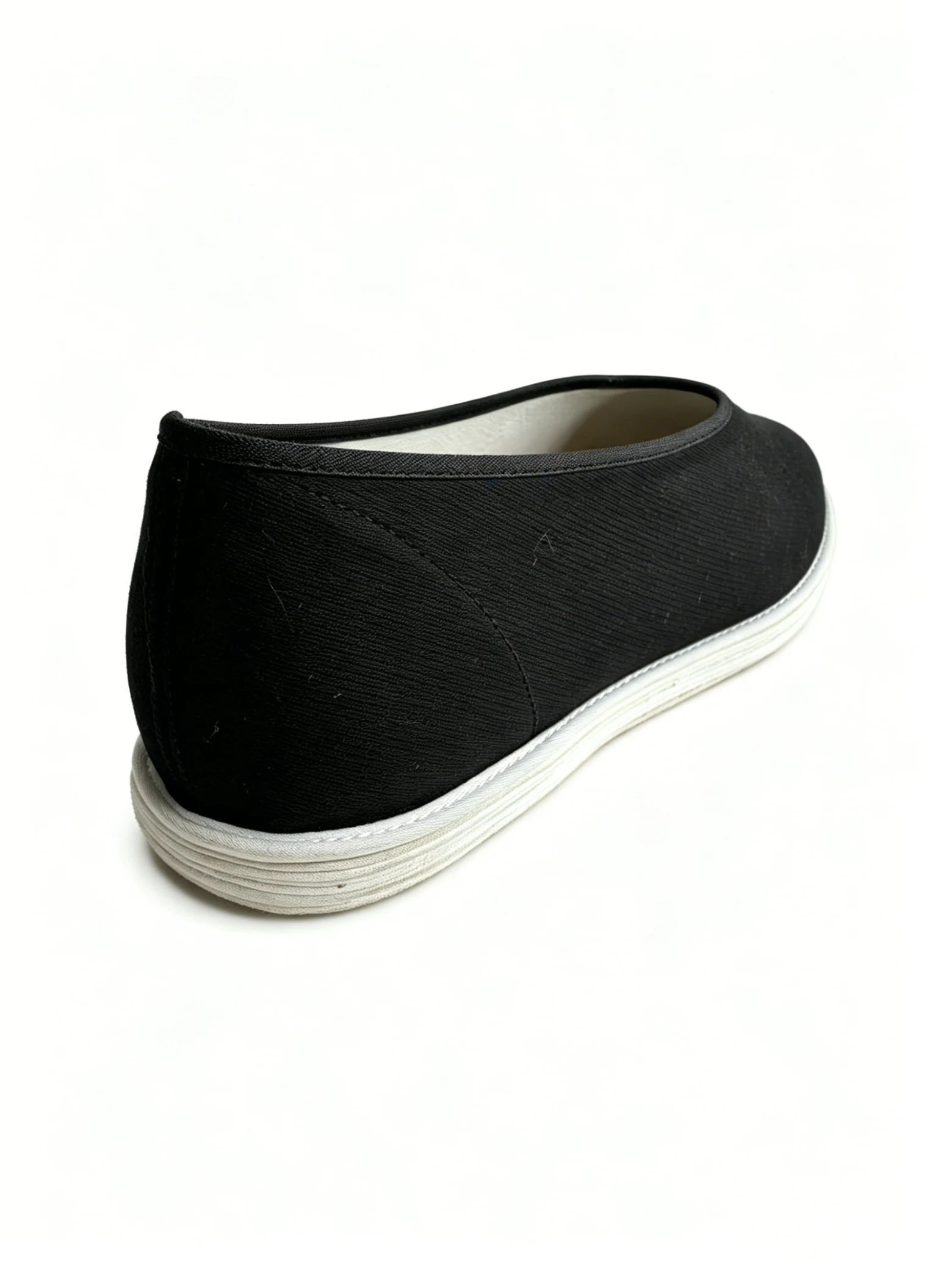 luno ln m3042 men's round toe cloth shoes formal fabric & hand stitched sole Rear side view of LUNO LN-M3042 men's round toe cloth shoes - black fabric upper with white rubber sole and reinforced heel stitching