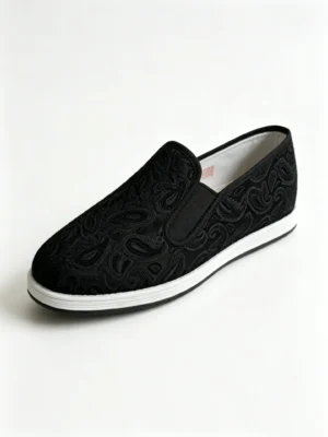 LUNO LN-M4017 men's black jacquard cloth shoes angled side view - showcasing a richly textured black upper with intricate paisley-style jacquard weave, paired with a clean white rubber sole; the slip-on design with elastic side panels ensures easy wear and all-day comfort, blending traditional craftsmanship with modern casual style.