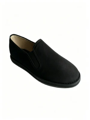 LUNO LN-M4019 men's traditional Chinese cloth shoes angled side view - featuring a sleek black canvas upper with a smooth texture and elastic side panels for easy slip-on wear, paired with a matching black rubber sole; the minimalist design emphasizes comfort and heritage craftsmanship, ideal for casual daily wear or cultural occasions.