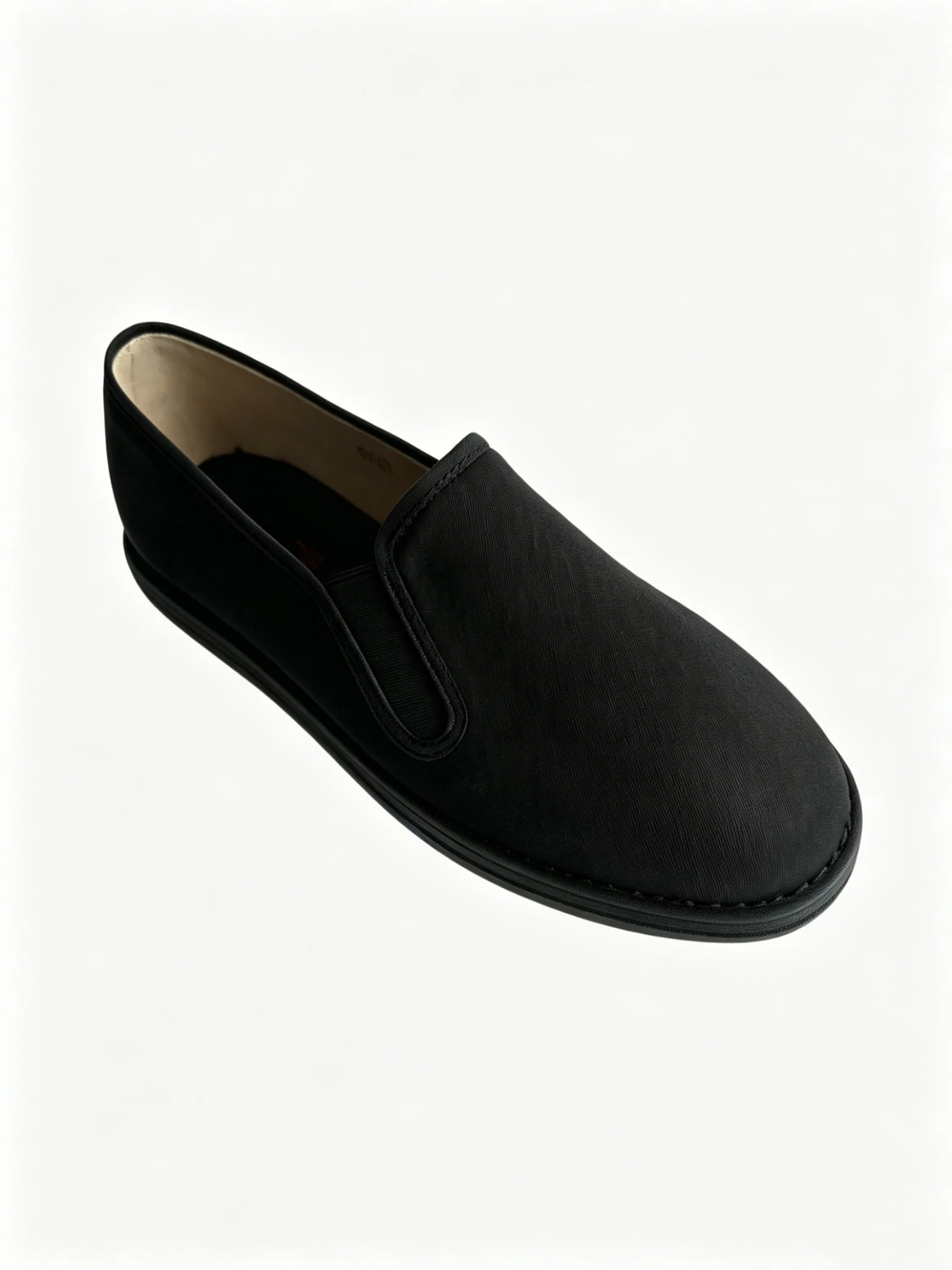luno ln m4019 men's traditional chinese cloth shoes LUNO LN-M4019 men's traditional Chinese cloth shoes angled side view - featuring a sleek black canvas upper with a smooth texture and elastic side panels for easy slip-on wear, paired with a matching black rubber sole; the minimalist design emphasizes comfort and heritage craftsmanship, ideal for casual daily wear or cultural occasions.