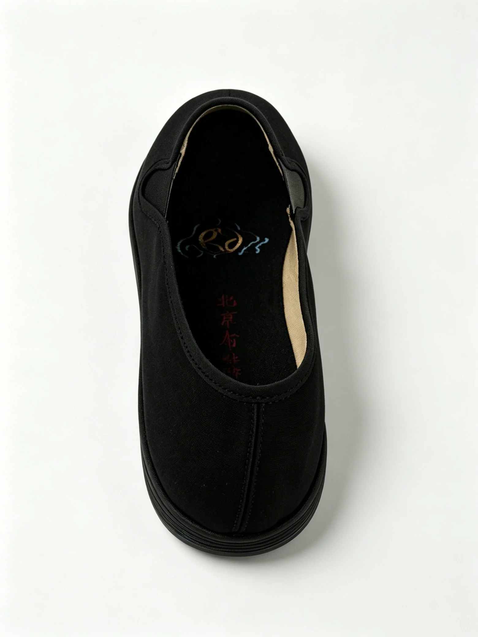 luno ln m4029 traditional chinese cloth shoes embroidered insole LUNO LN-M4029 traditional Chinese cloth shoes top-down view - featuring a black canvas upper with elastic side panels for easy slip-on wear, and an insole embroidered with a stylized logo and red "Beijing Cloth Shoes" characters.