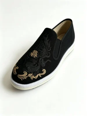 Side view of LUNO LN-M4036 men's traditional Chinese cloth shoes - featuring black canvas upper with intricate dragon embroidery and gold "Jin" character emblem, white layered sole edge for cultural symbolism and modern style.