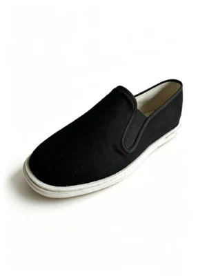 Side view of LUNO LN-M4043 men's slip-on shoes - black canvas upper with white rubber sole and elastic side panels for easy wear